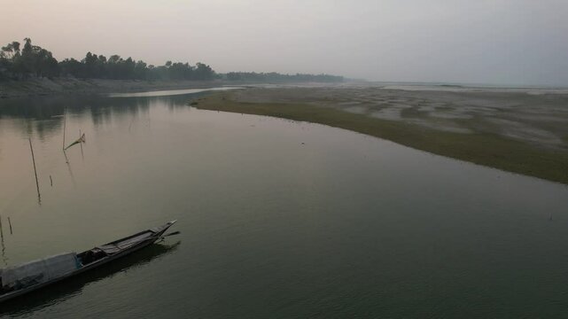 Aerial view of a local boats on a quiet river, Rajshahi, Sariakandi, Bangladesh