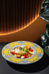 Delicious caesar salad with shrimps sitting on restaurant table