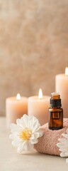 A serene setting featuring candles, essential oil, and a flower, perfect for relaxation and wellness themes.