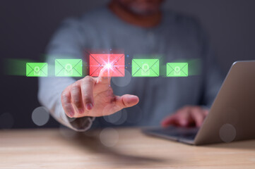 Person interacts with virtual email icons, highlighting secure and insecure messages image emphasizes importance of cybersecurity in digital communications for protecting sensitive information