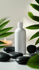 A serene composition featuring a white bottle mockup, black stones, a candle, and lush green leaves, perfect for wellness and relaxation themes.