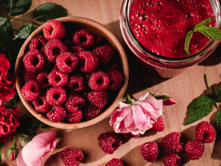 Fresh Raspberries: Juicy, Ripe Berries for a Healthy Summer Snack on a Wooden Background