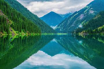 Fototapeta premium Lake Kolsay is located on the north slope of the Tian Shan Mountains, southeast Kazakhstan, within Kolsay Lakes National Park