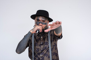 A controversial rapper freestyling lyrics on the microphone. A frontman full of face an body...