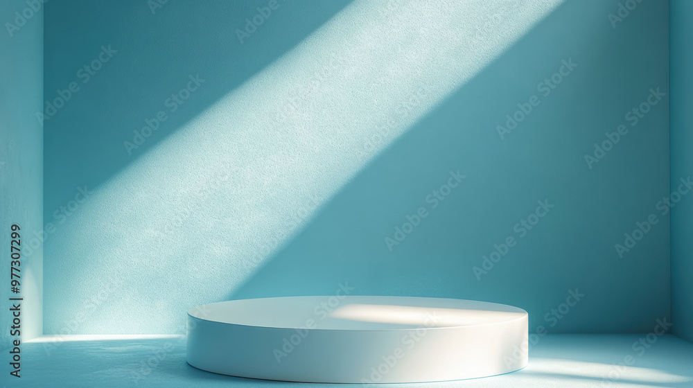 Poster a minimalist blue room with natural light illuminating an empty white circular platform, creating a 