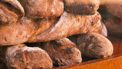 Artisan fresh bread on a street showcase, golden brown crust and rustic appearance