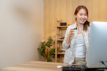 A woman working with video editor at home
