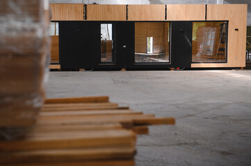 A new wooden modular prefabricated house inside in manufacturing facility