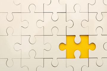Fototapeta premium White puzzle with missing piece on yellow background, top view