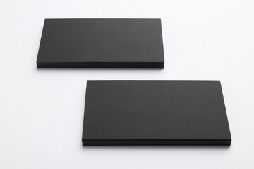 Blank business cards on light grey background. Mockup for design