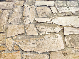 The textured stone surface displays intricate patterns, offering a unique backdrop with space for additional text or graphics