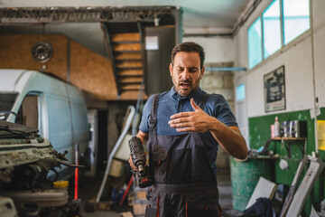 car mechanic explain car repair process in a workshop environment