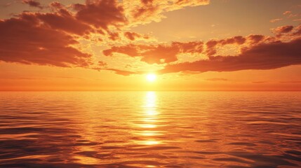 Fototapeta premium A golden sunset over a calm ocean