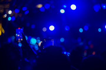 blurred concert stage lights bokeh, abstract music blue clolor lights background