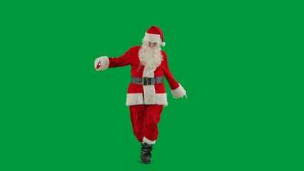 Portrait of man dressed as Santa on chroma key green screen background. Santa Claus in red suit dancing funny.