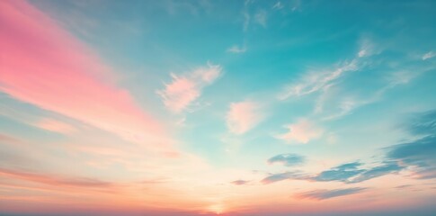 Naklejka premium Dramatic pink and blue cloudscape illuminating the sky at sunset