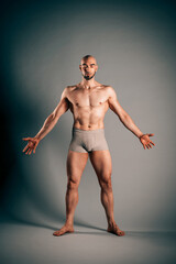 Shirtless male dancer showing perfect body in studio