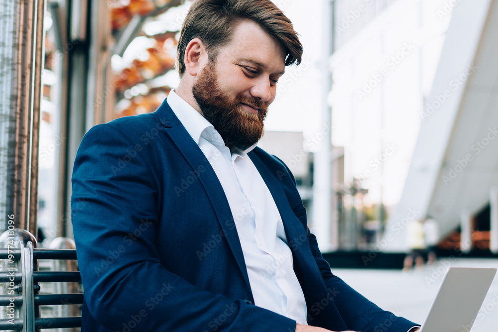 Poster formally dressed businessman sitting on urban setting and working online with presentation for enter