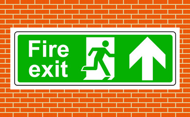 Obraz premium Fire exit up sign on the wall