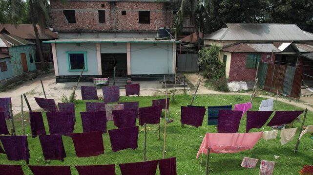 Drying fabrics under the sun, Dhaka Division, Rupganj, Bangladesh