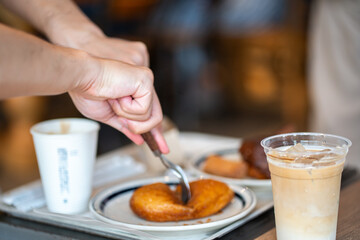 Man take delicious breakfast. Sour Dough. Dessert and drinks table. Vertical format.