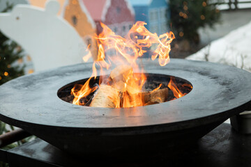 A cozy fire where they gather to cook delicious food during the wonderful winter time