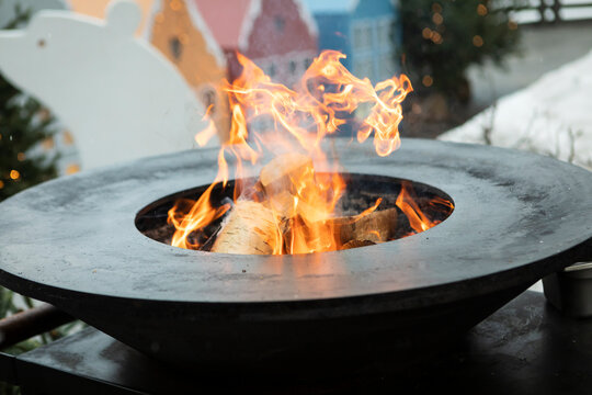 A cozy fire where they gather to cook delicious food during the wonderful winter time