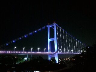 Bosphorus bridge illuminated at night