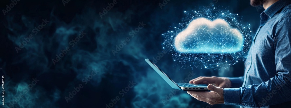 Fototapete The hand of a person showing a laptop computer connected to the internet for cloud data transfer. The image shows cloud computing technology and online data storage for business networks.