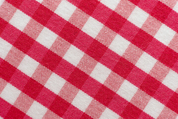 The texture of linen fabric in a large cage of pink  and white. Scottish tailoring material....