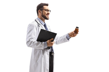 Male doctor holding a bottle of pills