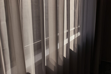 Window curtain in a plain hotel room