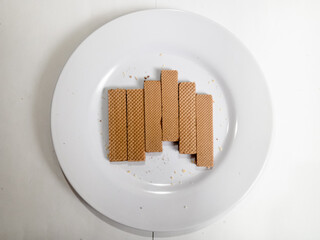 collection of chocolate wafer biscuits on a white plate