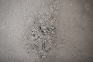 Ancient human skeletons with Dvaravati period items discovered in Si Thep Historical Park,the one...