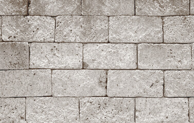 Ancient grey laterite brick wall for abstract seamless background and texture. beautiful patterns, space for work, close up.