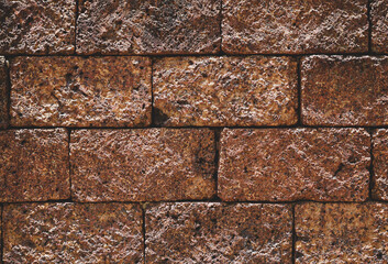 Ancient laterite brick wall for abstract seamless background and texture. beautiful patterns, space for work, close up.