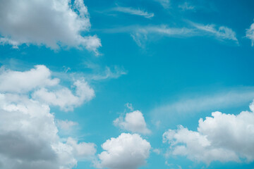 Beautiful white puffy clouds against blue sky on a sunny. Summer day.