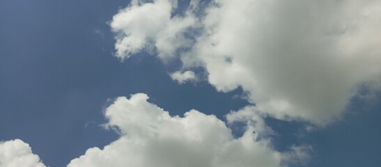 White clouds over blue sky