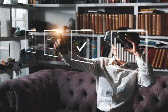 Businessman worker using VR virtual reality augment headset gear folder data and document management system DMS, information computer system storage data technology, document sharing and transfer.