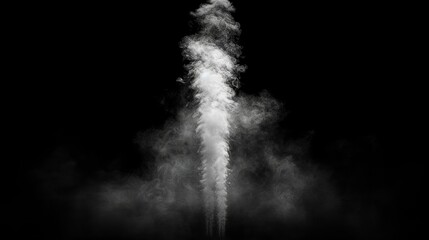 Dense white smoke rises in a dramatic formation against a black background, creating a captivating visual effect at night