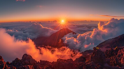 Watching the sunrise at Haleakalā National Park, Hawaii, unveils a surreal landscape as the sun rises above the clouds, illuminating the volcanic crater below. The dramatic colors and vast expanse 