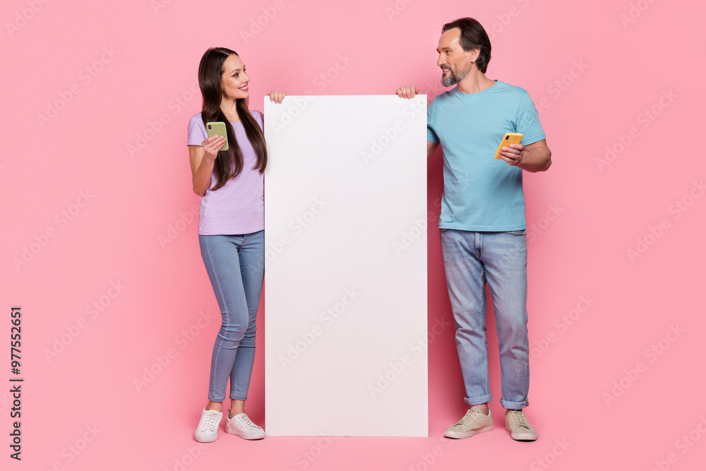 Canvas Prints Full size photo of two people use telephone blogging empty space large screen display isolated on pink color background