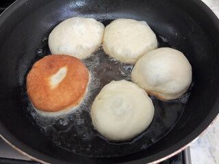 Traditional German or Austrian fried donuts with no hole, so called Krapfen, Berliner or Pfannkuchen
