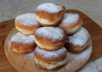 Traditional German or Austrian fried donuts with no hole, so called Krapfen, Berliner or Pfannkuchen