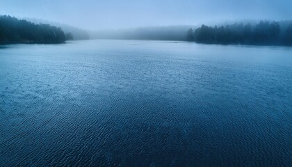 Fototapeta premium Tranquil lake under a misty sky