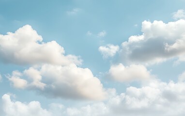 Fototapeta premium Fluffy white clouds drift across a bright blue sky, a serene and peaceful scene.
