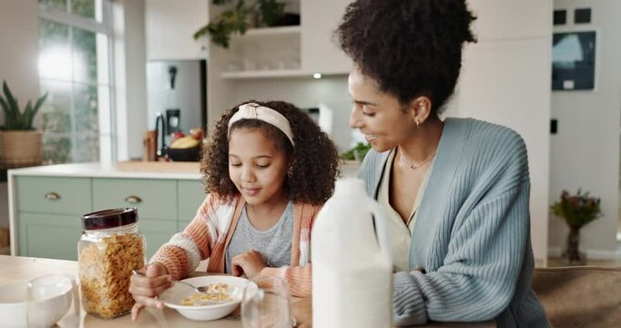 Mother, girl and morning breakfast in home, cereal and nutrition meal with milk for calcium and energy. Child, happy and eating in kitchen table together, healthy and childcare bonding for growth