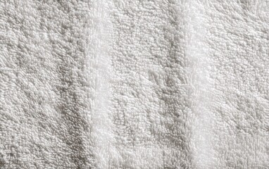 Obraz premium Close-up of a soft, white towel with a textured surface.