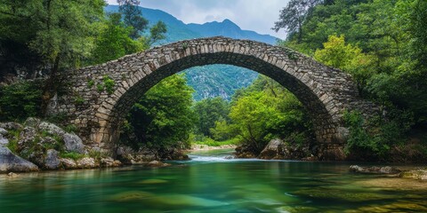 Fototapeta premium quaint stone bridge over a river 