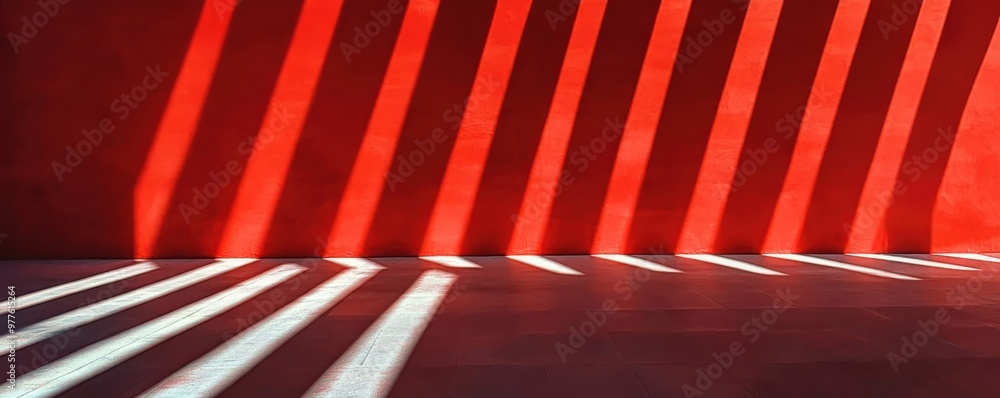 Poster bold red wall with striking horizontal shadows and light patterns creating a dramatic and modern abs